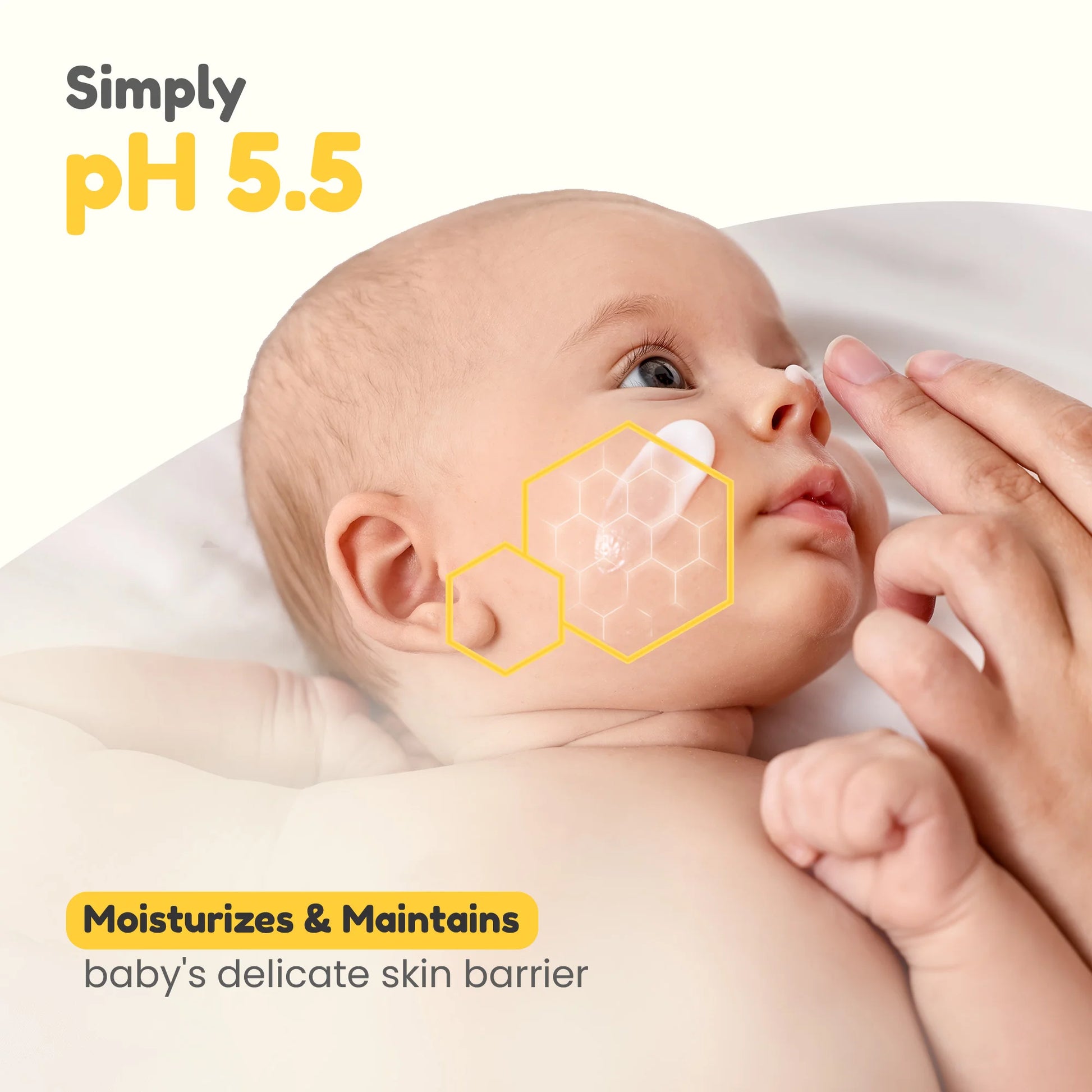 Close-up of baby face cream application, showing the pH 5.5 formula that supports and maintains a healthy baby skin barrier.