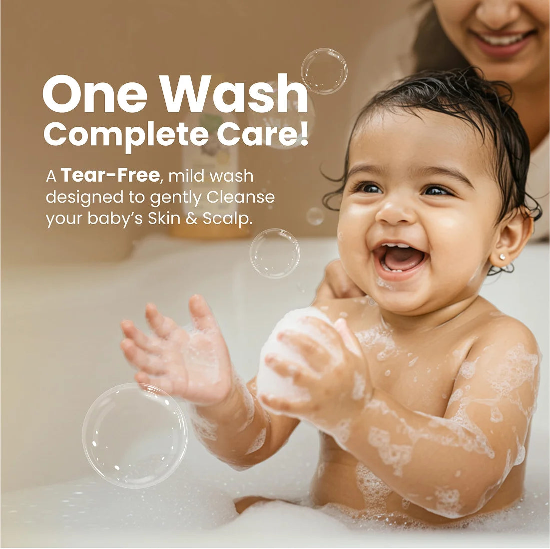 Mom gently applying fragrance-free baby wash to baby's skin