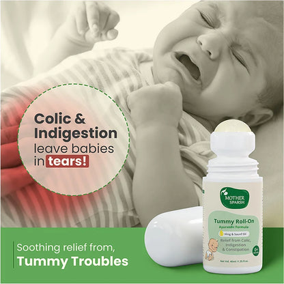 Crying baby receiving soothing relief from colic and indigestion with a natural tummy roll on.