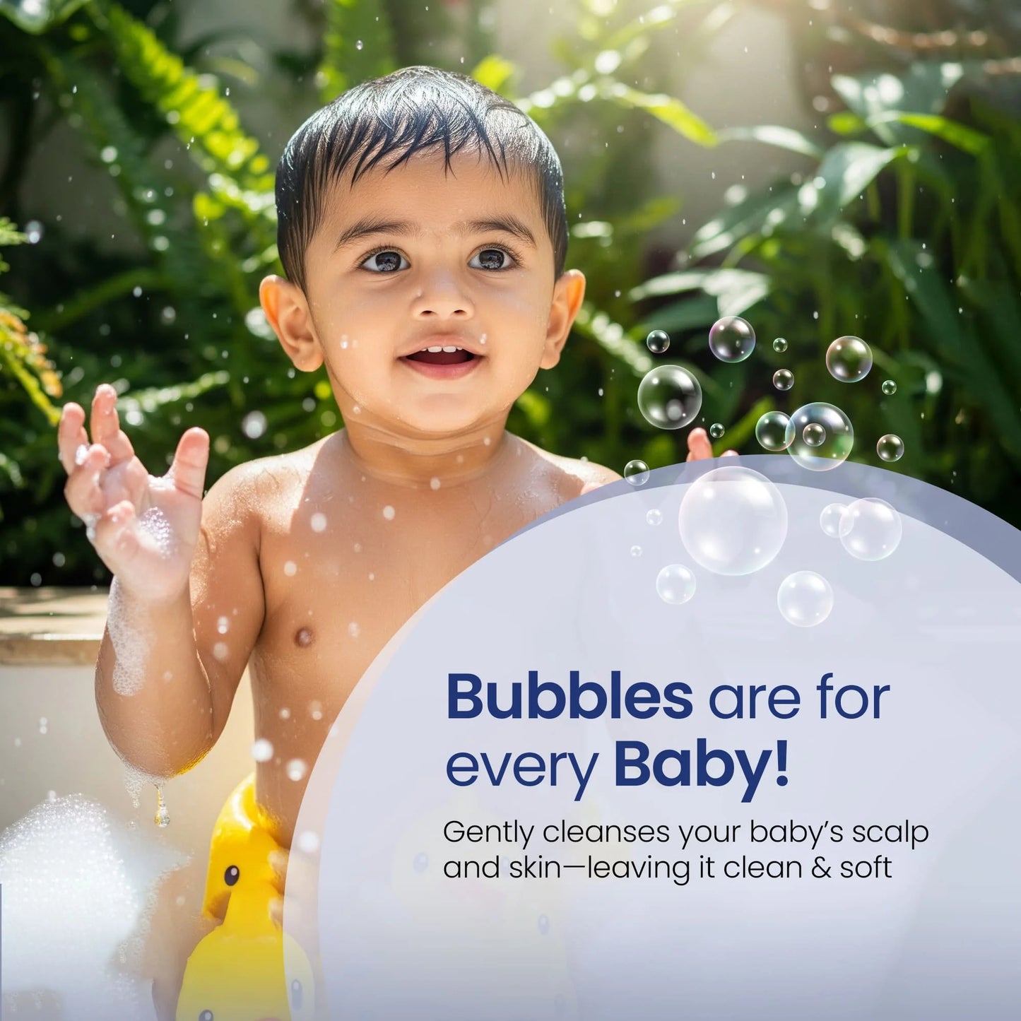Happy baby enjoying bath time with soft bubbles using natural baby shampoo
