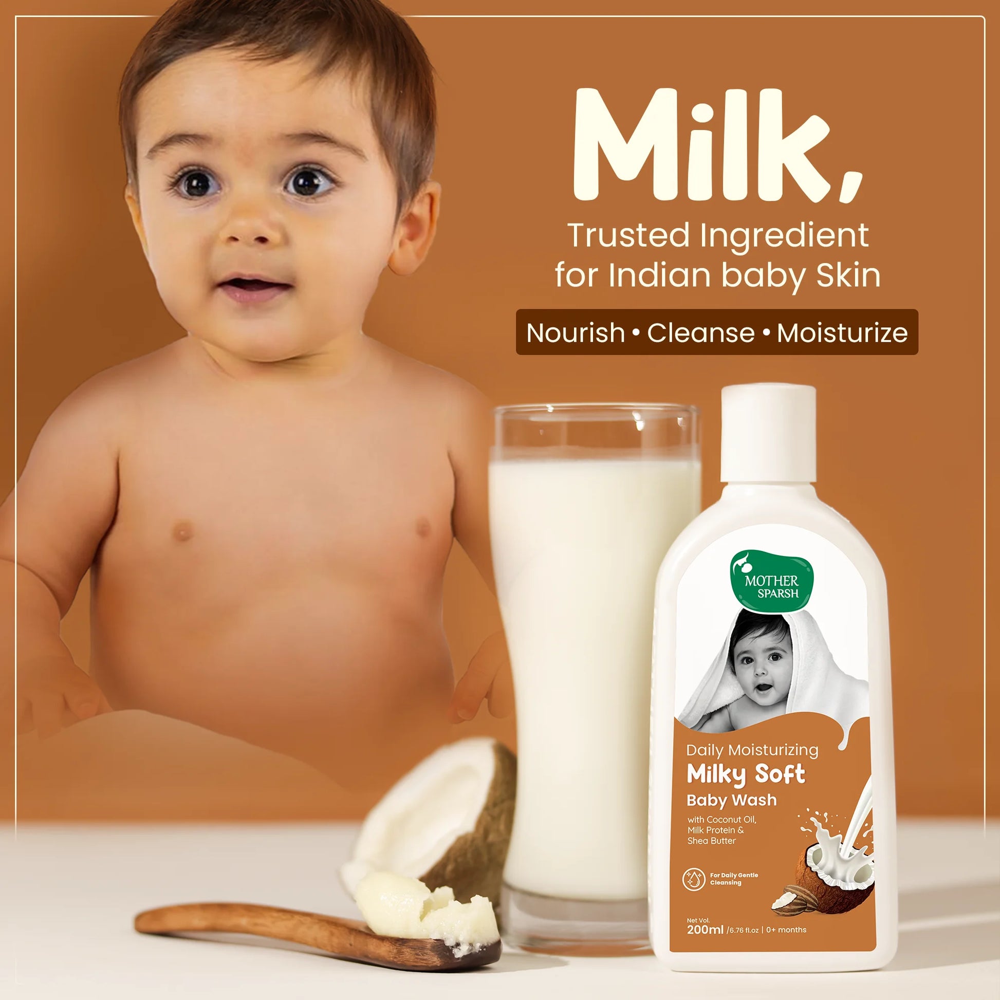Mother Sparsh Milky Soft Baby Wash 200ml with milk and coconut oil. The image features a baby, a bottle of the baby wash, a glass of milk, a cracked coconut, and a spoonful of shea butter, highlighting the key ingredients for nourishing, cleansing, and moisturizing Indian baby skin.