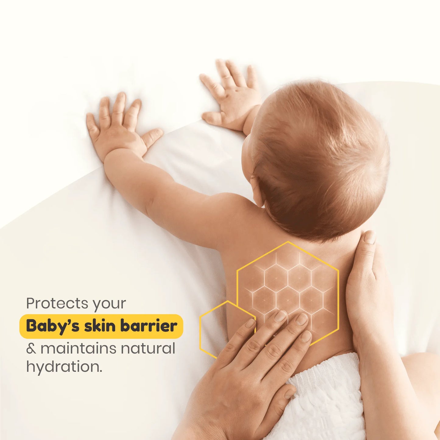 Mother applying lotion to baby's back, emphasizing pH 5.5 formula protects baby's skin barrier and maintains natural hydration.